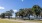 a large area surrounded by trees and buildings