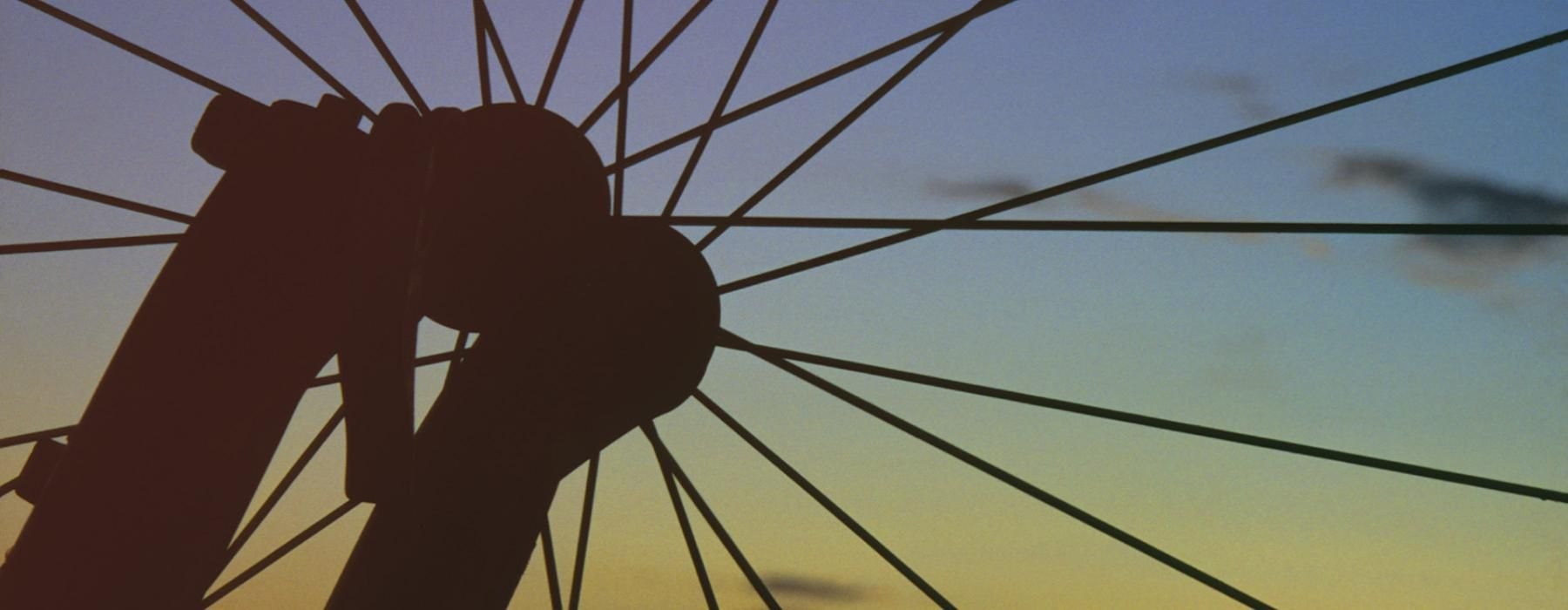 a silhouette of bicycles